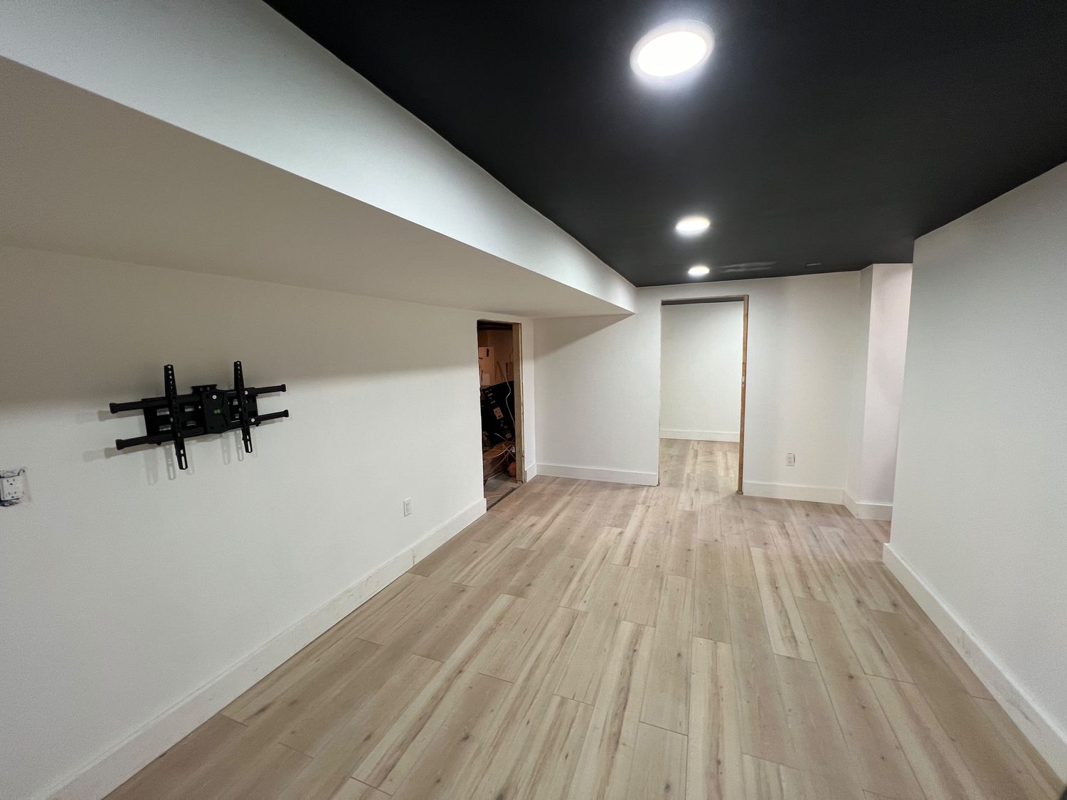 Basement with Black Ceiling and Grey Bath