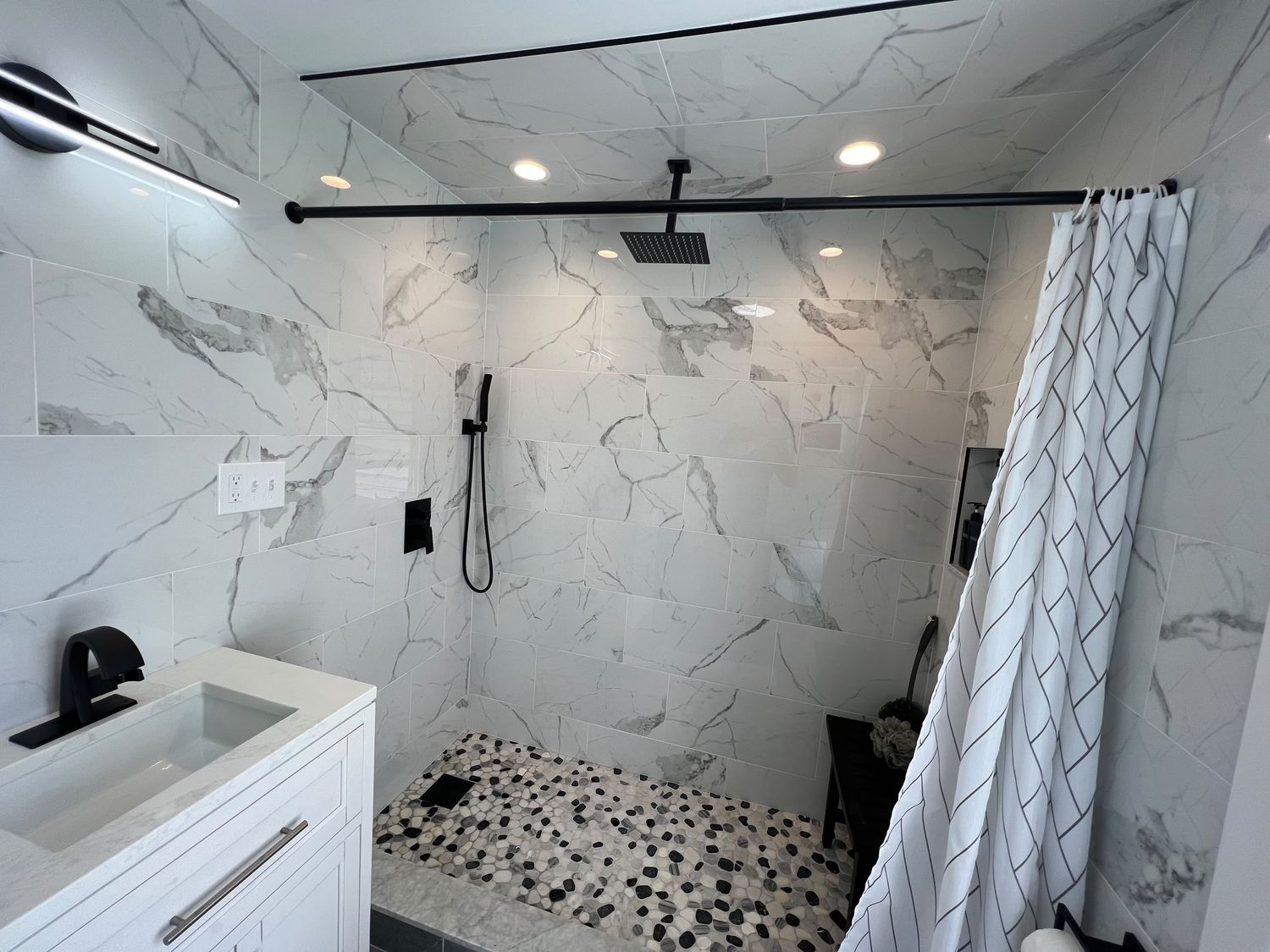 Marble Baths with Pebble Shower Floors