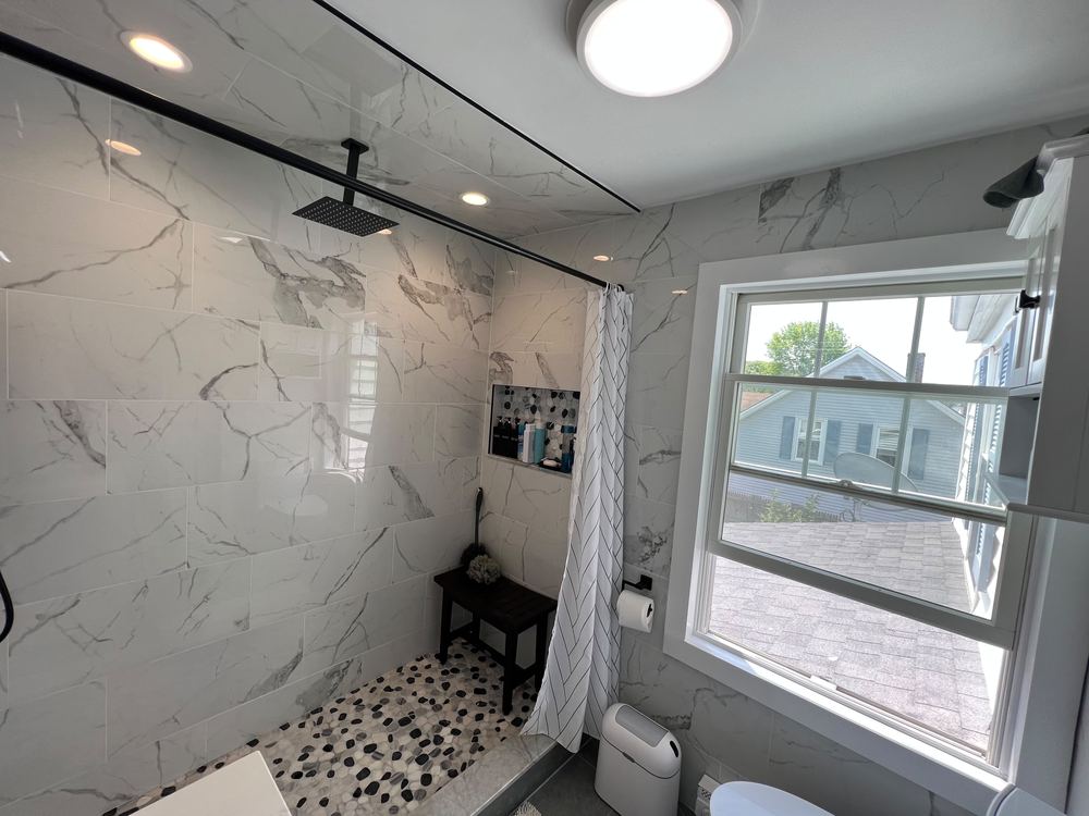 Marble Baths with Pebble Shower Floors